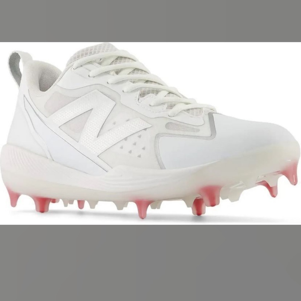 New Balance Women's White Athletic Cleats with Pink Accents